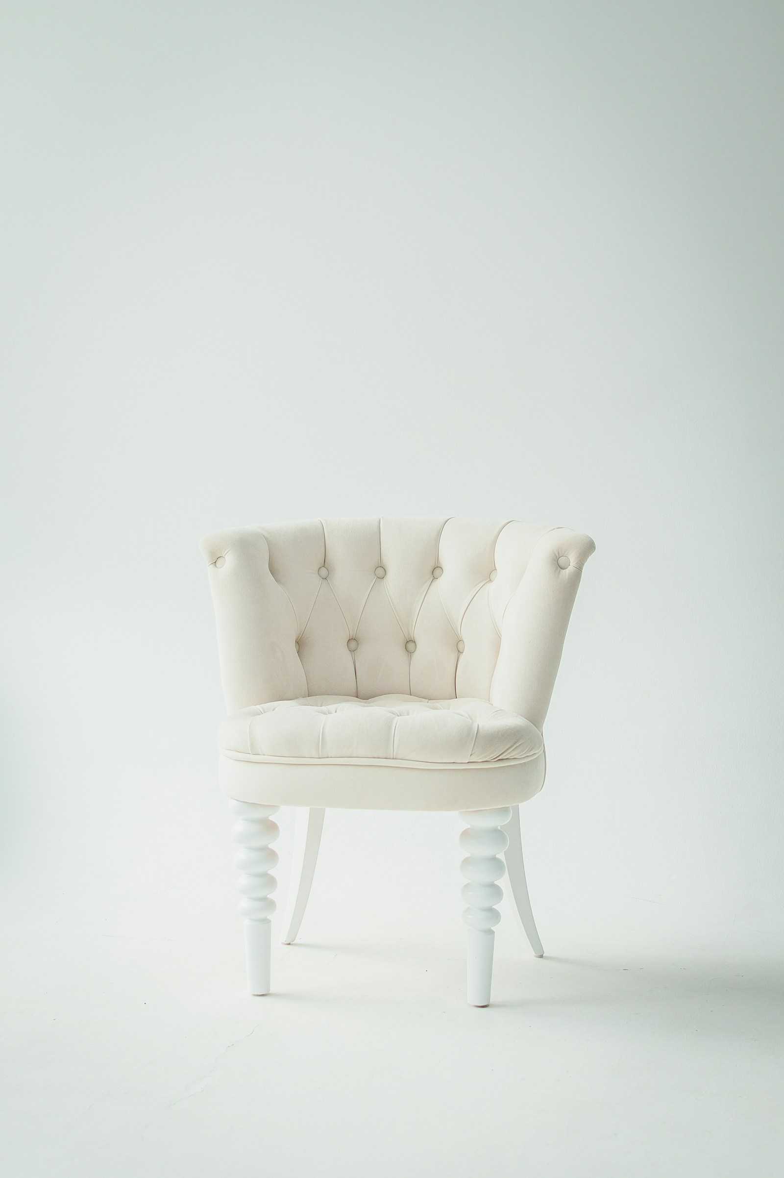 Sculptural cream upholstered chair